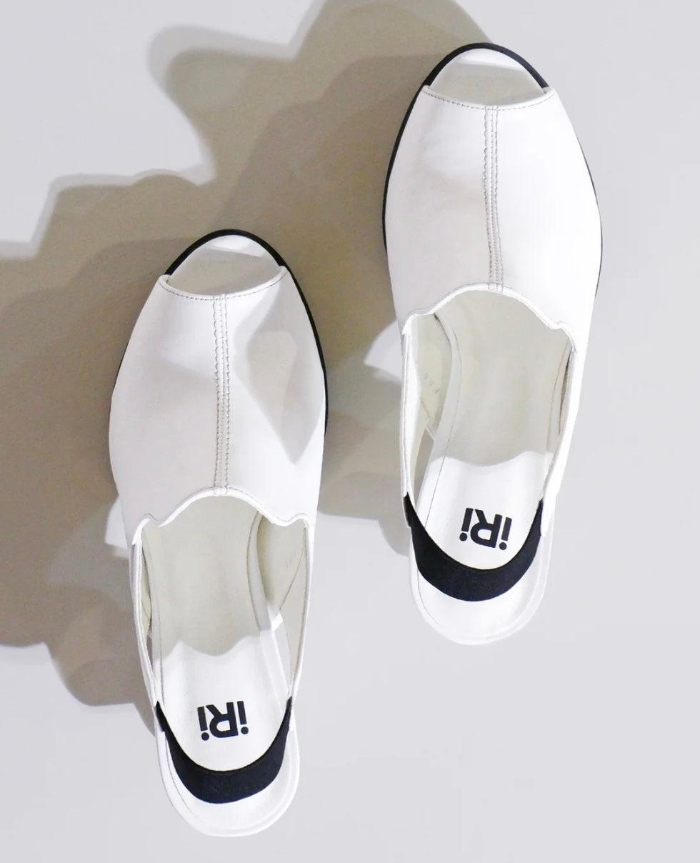 White heel with black & yellow sole top view