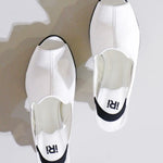 White heel with black & yellow sole top view