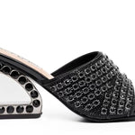 Black embellished high-heeled shoes close-up