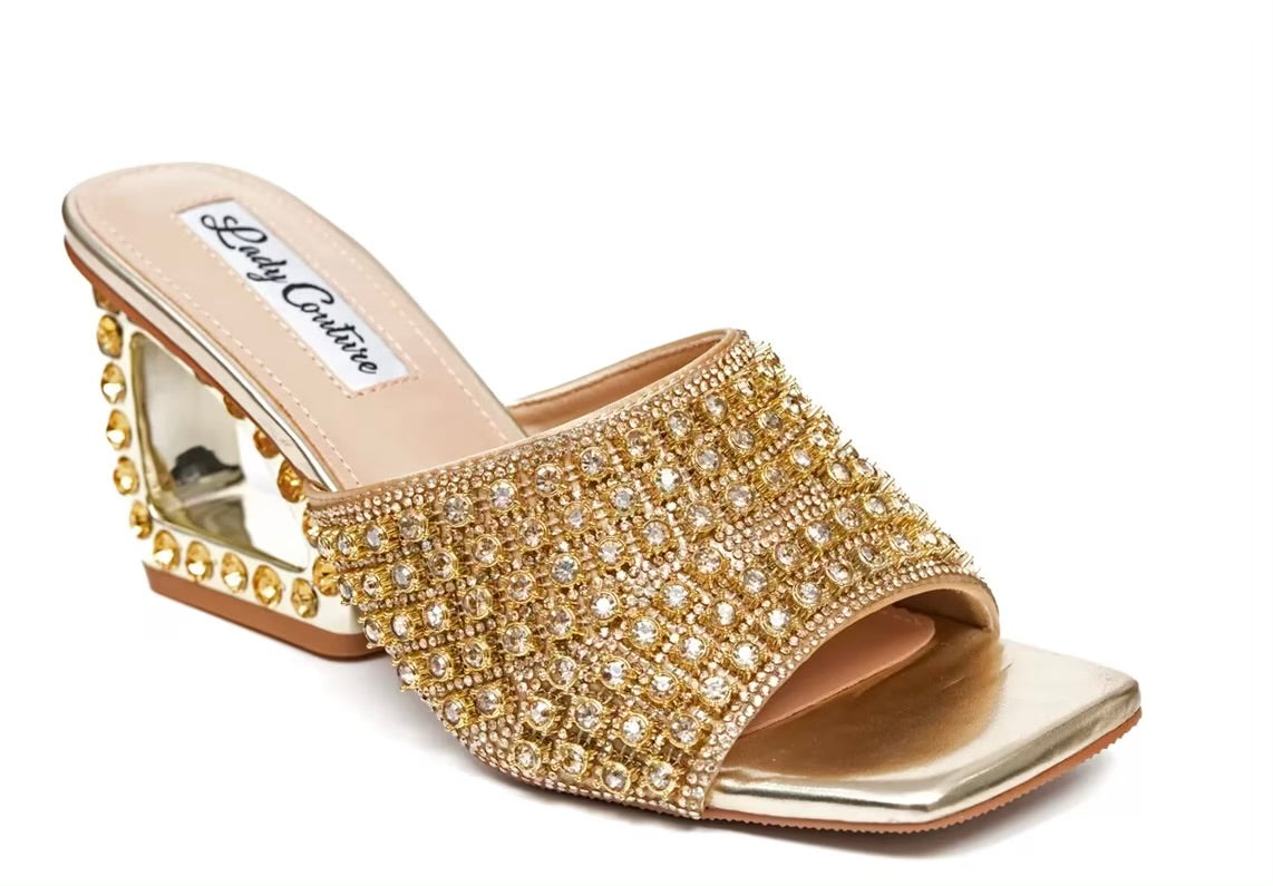 Gold embellished high-heeled shoe front view