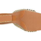 Gold embellished high-heeled shoe sole