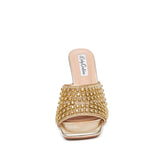 Gold embellished high-heeled shoe toe box