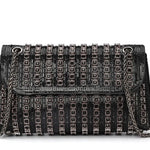 Black beaded patterned handbag with black chain strap close-up