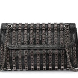 Black beaded patterned handbag with black chain strap close-up