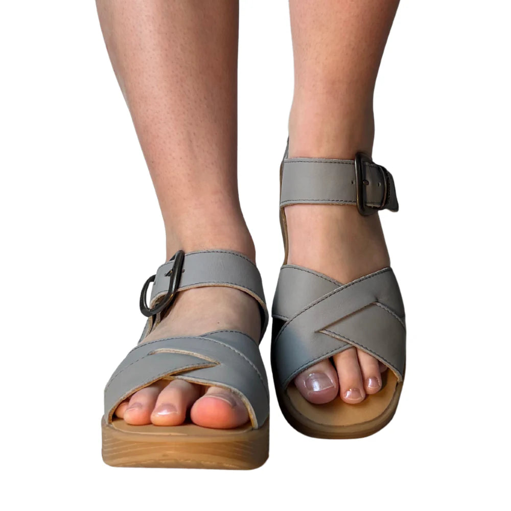 Gray sandal with a brown platform sole and brass buckle closure model
