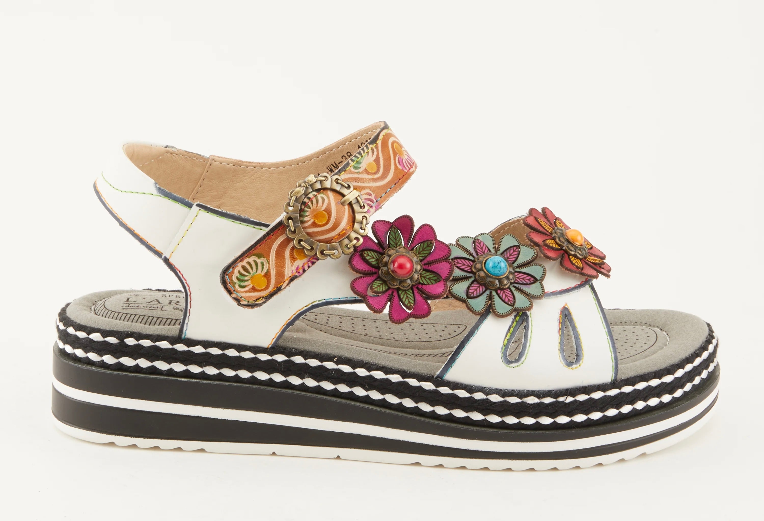 White sandal with colorful floral decorations and black & white sole close-up