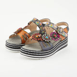 Black sandal with colorful floral decorations and black & white sole pair