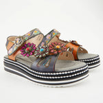 Black sandal with colorful floral decorations and black & white sole pair alternate view
