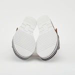 Black sandal with colorful floral decorations and black & white sole sole view