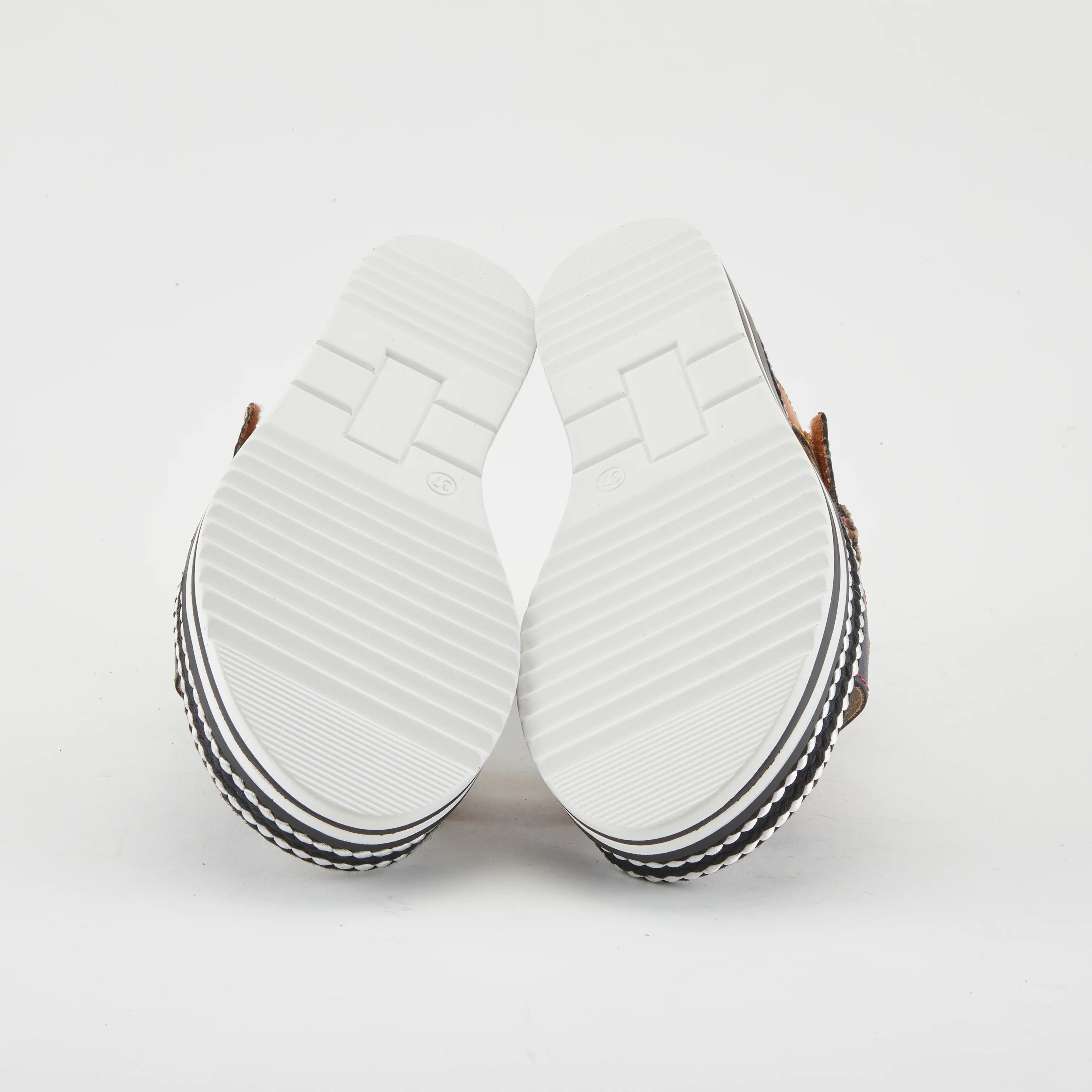 Black sandal with colorful floral decorations and black & white sole sole view