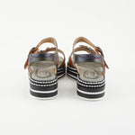 Black sandal with colorful floral decorations and black & white sole heel view