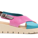 Pink and blue wedge with a beige sole, brown heel strap and buckle closure close-up