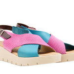 Pink and blue wedge with a beige sole, brown heel strap and buckle closure pair
