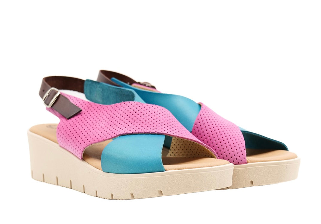 Pink and blue wedge with a beige sole, brown heel strap and buckle closure pair