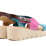 Pink and blue wedge with a beige sole, brown heel strap and buckle closure pair heel view
