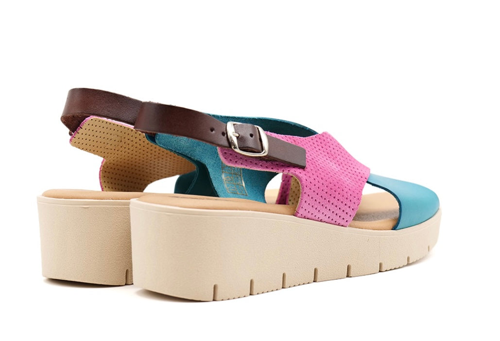 Pink and blue wedge with a beige sole, brown heel strap and buckle closure pair heel view