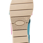 Pink and blue wedge with a beige sole, brown heel strap and buckle closure bottom view