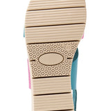 Pink and blue wedge with a beige sole, brown heel strap and buckle closure bottom view