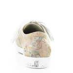 Green & mauve floral patterned sneaker with white sole heel view