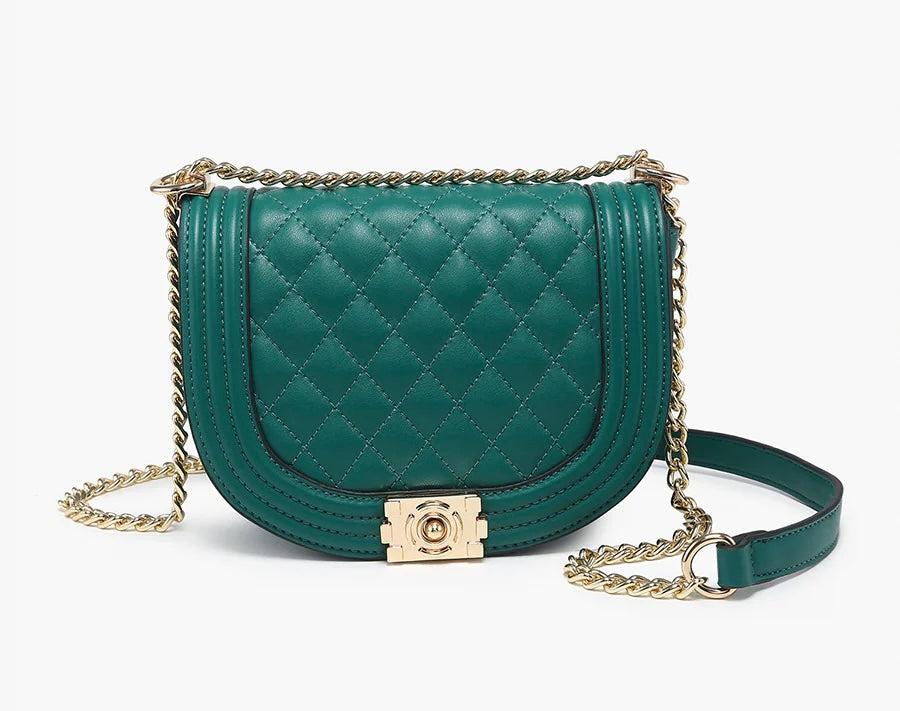 Green quilted handbag with gold chain strap close-up
