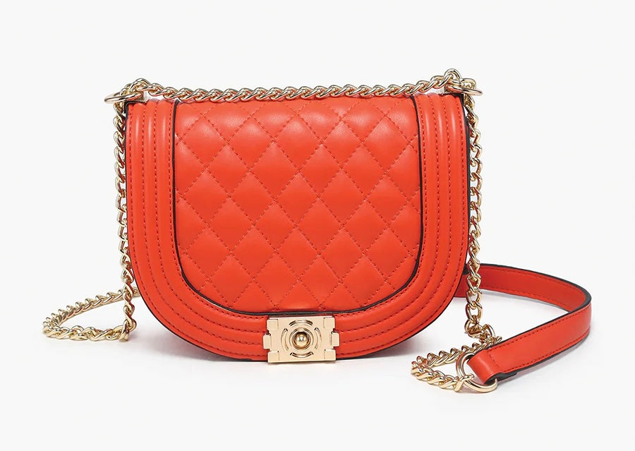 Orange quilted handbag with gold chain strap close-up