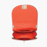 Orange quilted handbag with gold chain strap opening