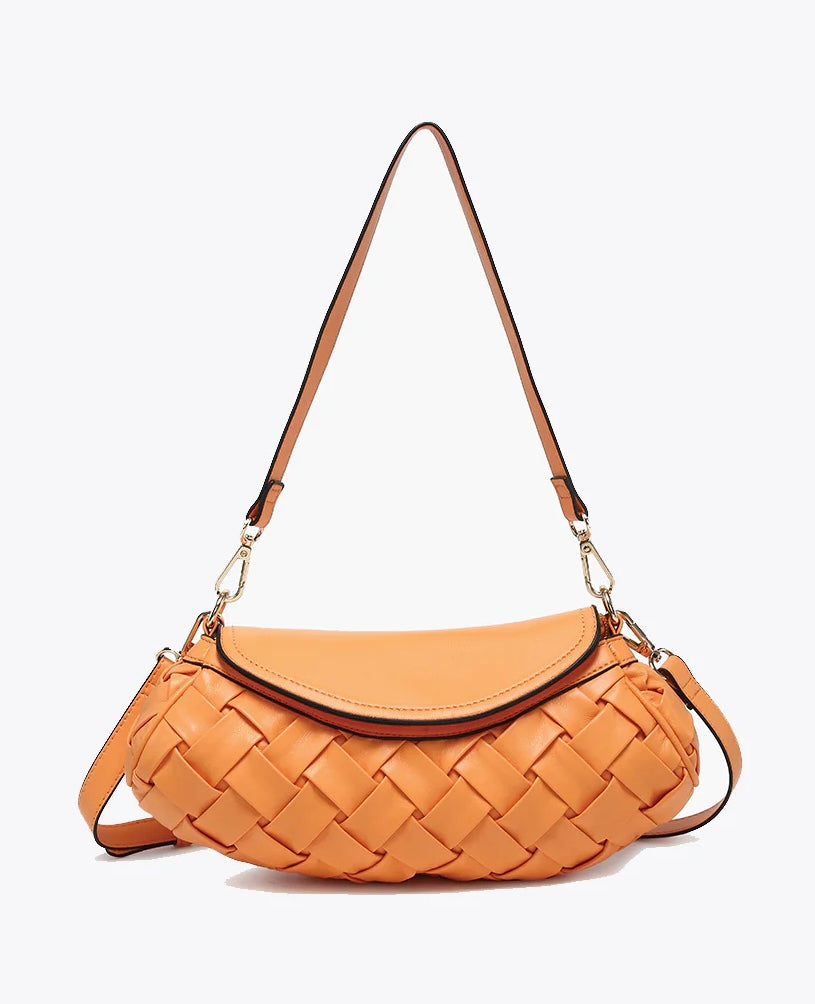 Orange handbag with woven texture and gold accents close-up