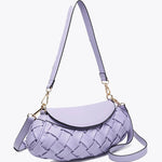 Lavender handbag with woven texture and gold accents side view
