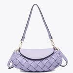 Lavender handbag with woven texture and gold accents close up