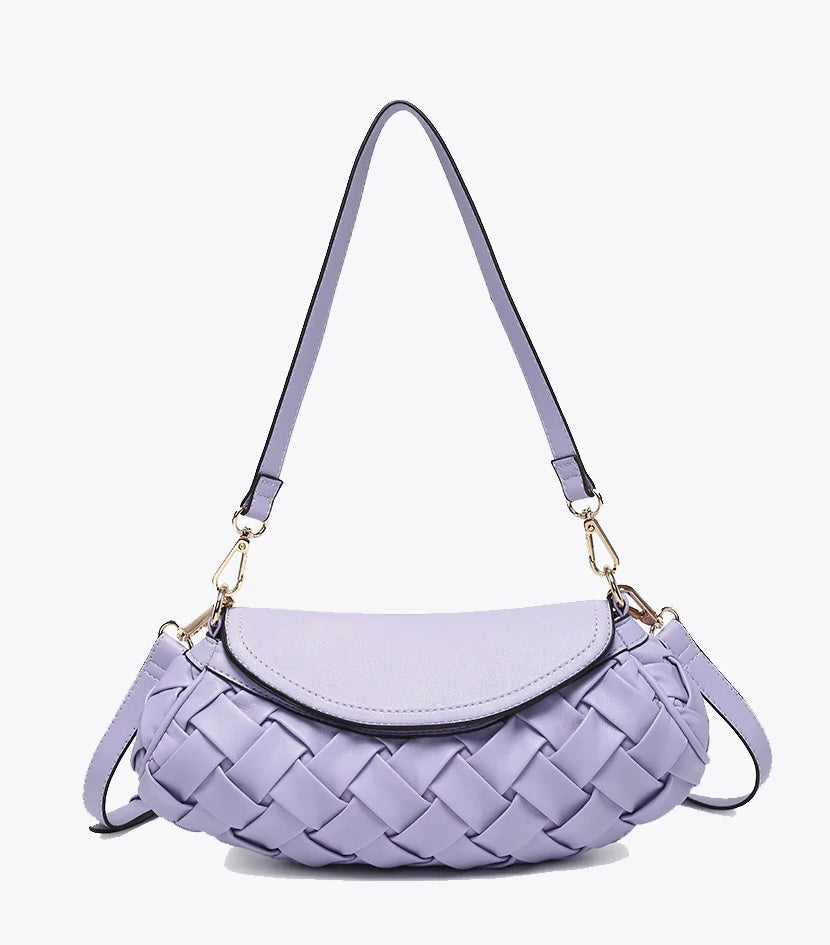 Lavender handbag with woven texture and gold accents close up
