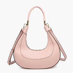Pink handbag with a hand strap and shoulder strap close-up