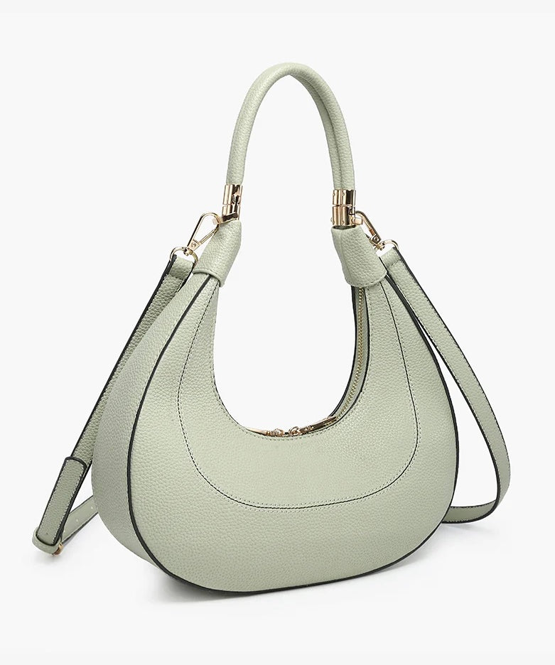 Light green handbag with a hand strap and shoulder strap alt view
