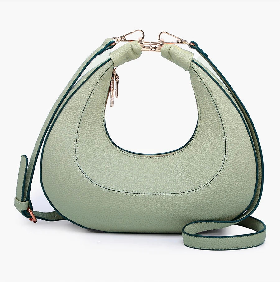 Light green handbag with a hand strap and shoulder strap back