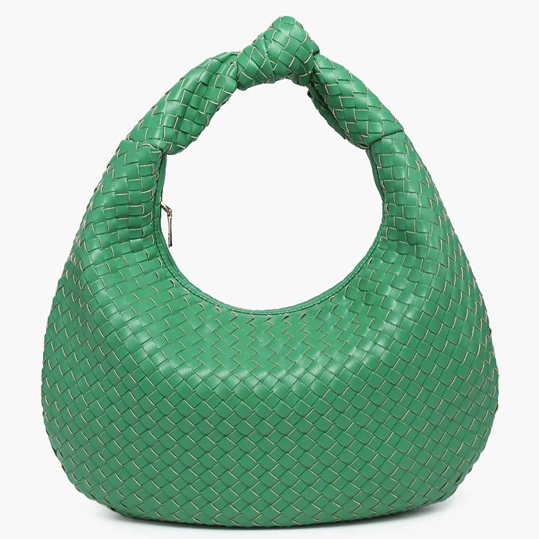 Green woven handbag close-up