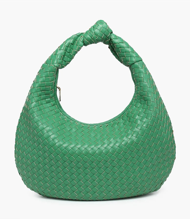 Green woven handbag close-up