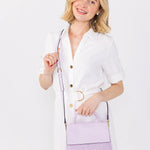 Light green handbag with a chain detail, hand strap and shoulder strap model