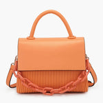 Orange handbag with a chain detail, hand strap and shoulder strap close-up