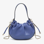 Blue handbag with chain detail and hand strap close-up