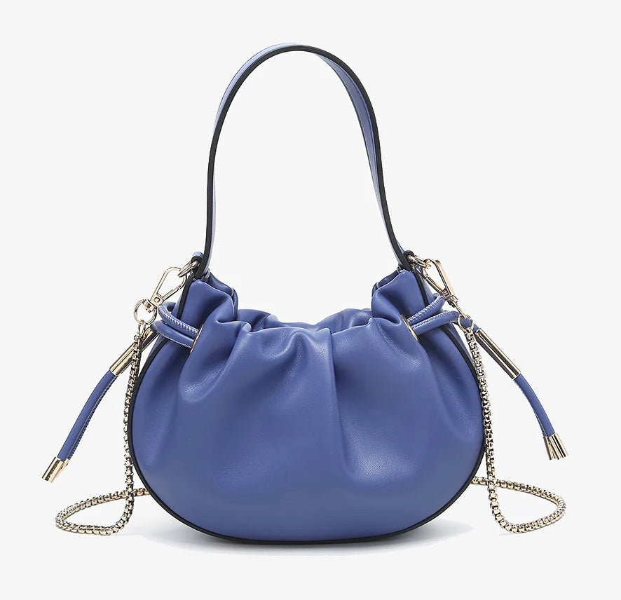 Blue handbag with chain detail and hand strap close-up