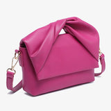 Pink handbag with a bow design alt view