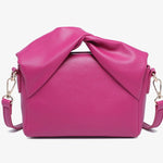 Pink handbag with a bow design back