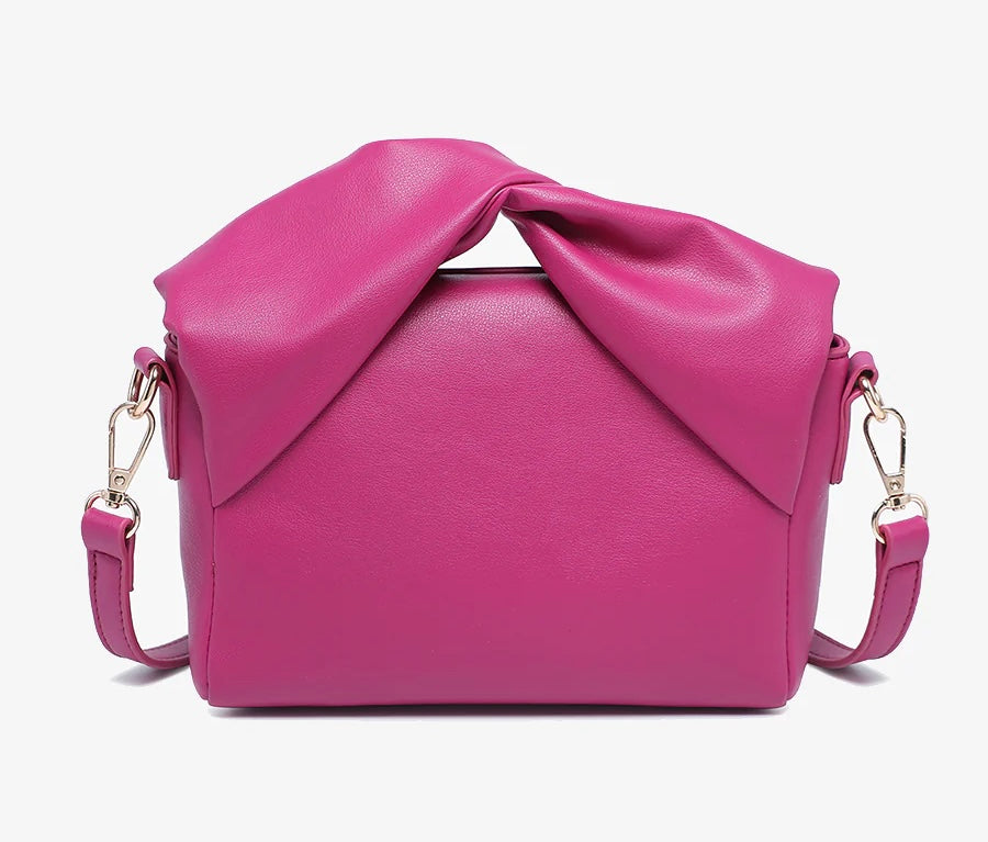 Pink handbag with a bow design back