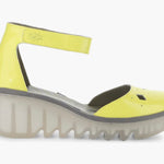 Yellow wedge with clear sole and velcro strap close-up