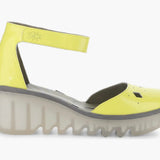 Yellow wedge with clear sole and velcro strap close-up
