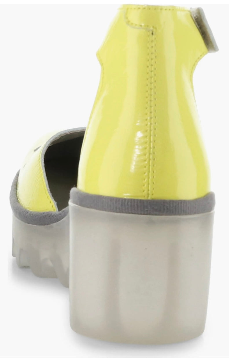 Yellow wedge with clear sole and velcro strap heel view