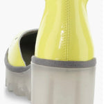 Yellow wedge with clear sole and velcro strap heel view