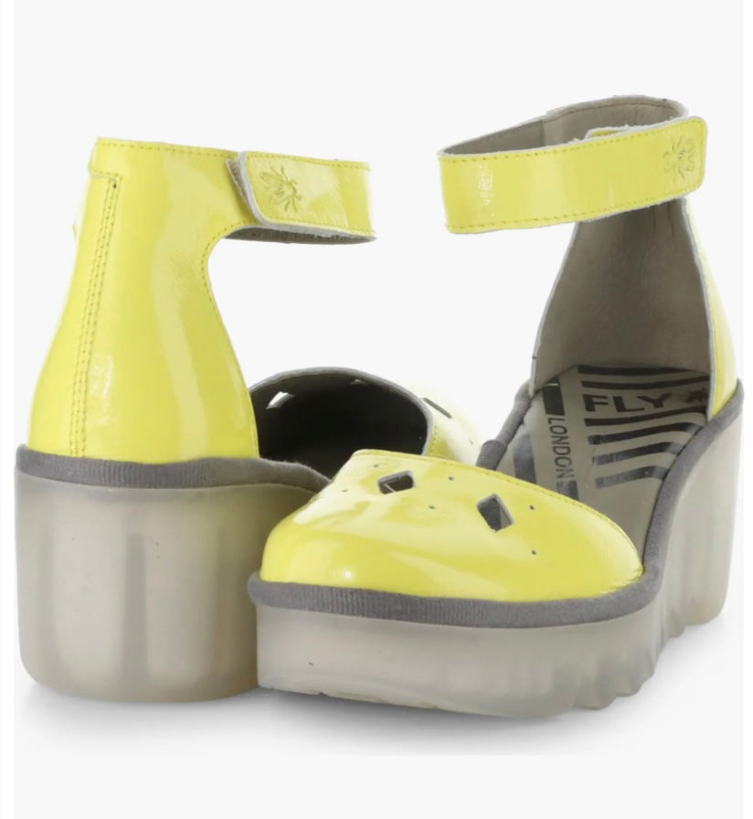 Yellow wedge with clear sole and velcro strap pair