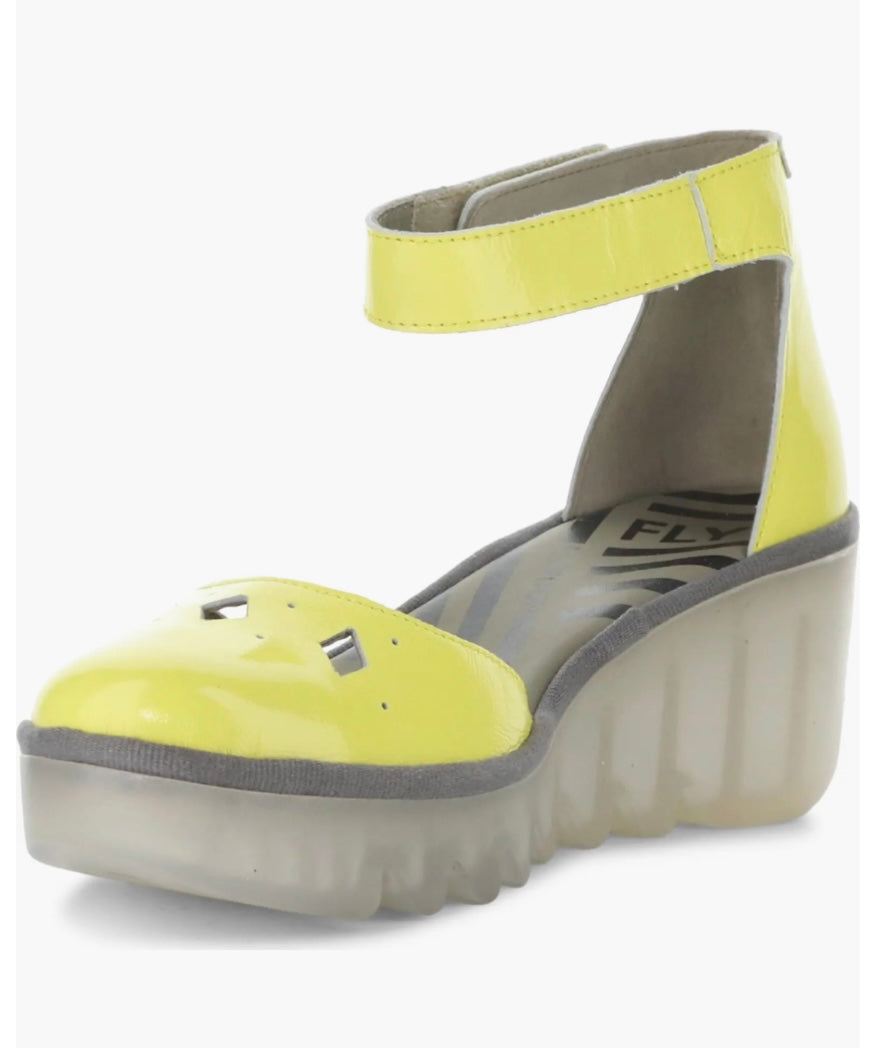 Yellow wedge with clear sole and velcro strap front alternate view