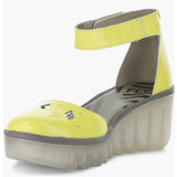 Yellow wedge with clear sole and velcro strap front alternate view