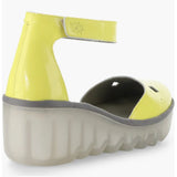 Yellow wedge with clear sole and velcro strap rear view